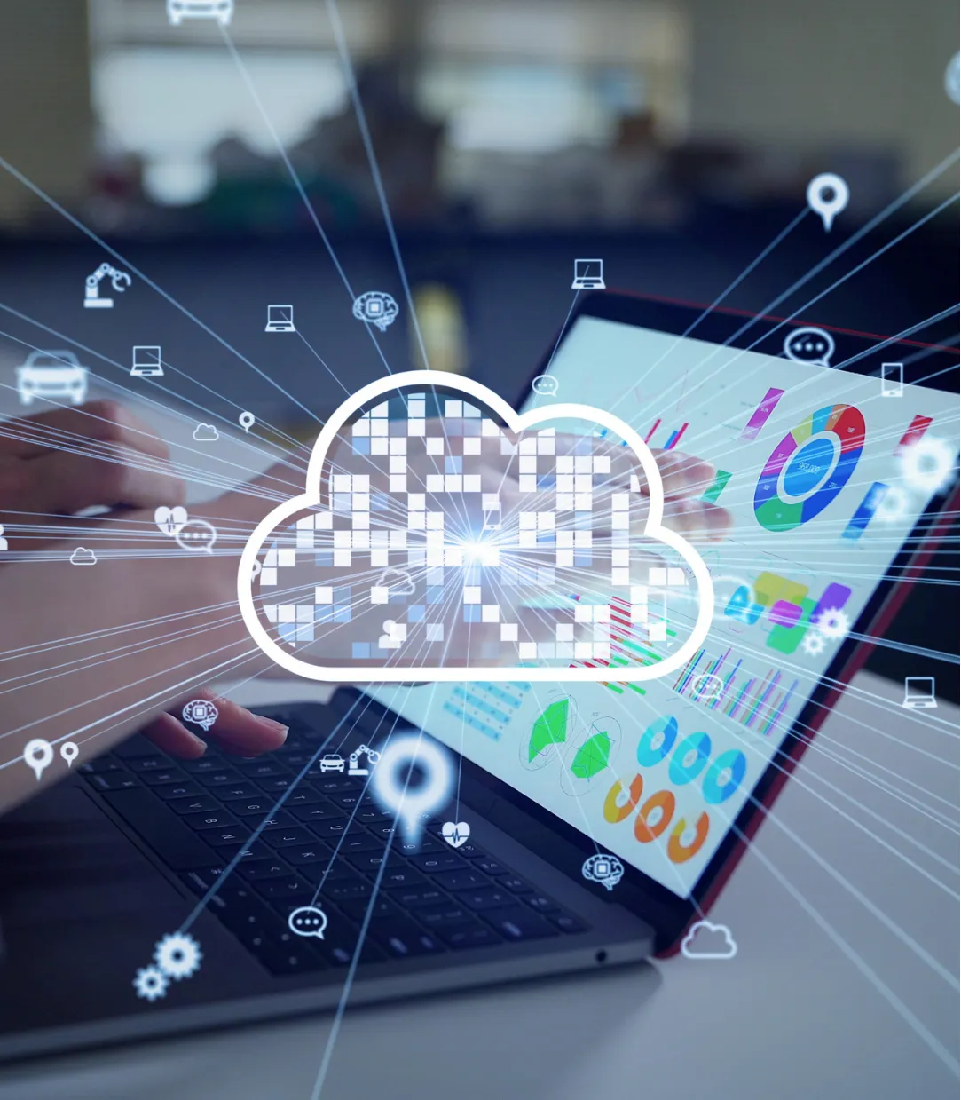 cloud-2 Hands typing on a laptop with colorful charts, overlaid by a digital cloud and network icons.
