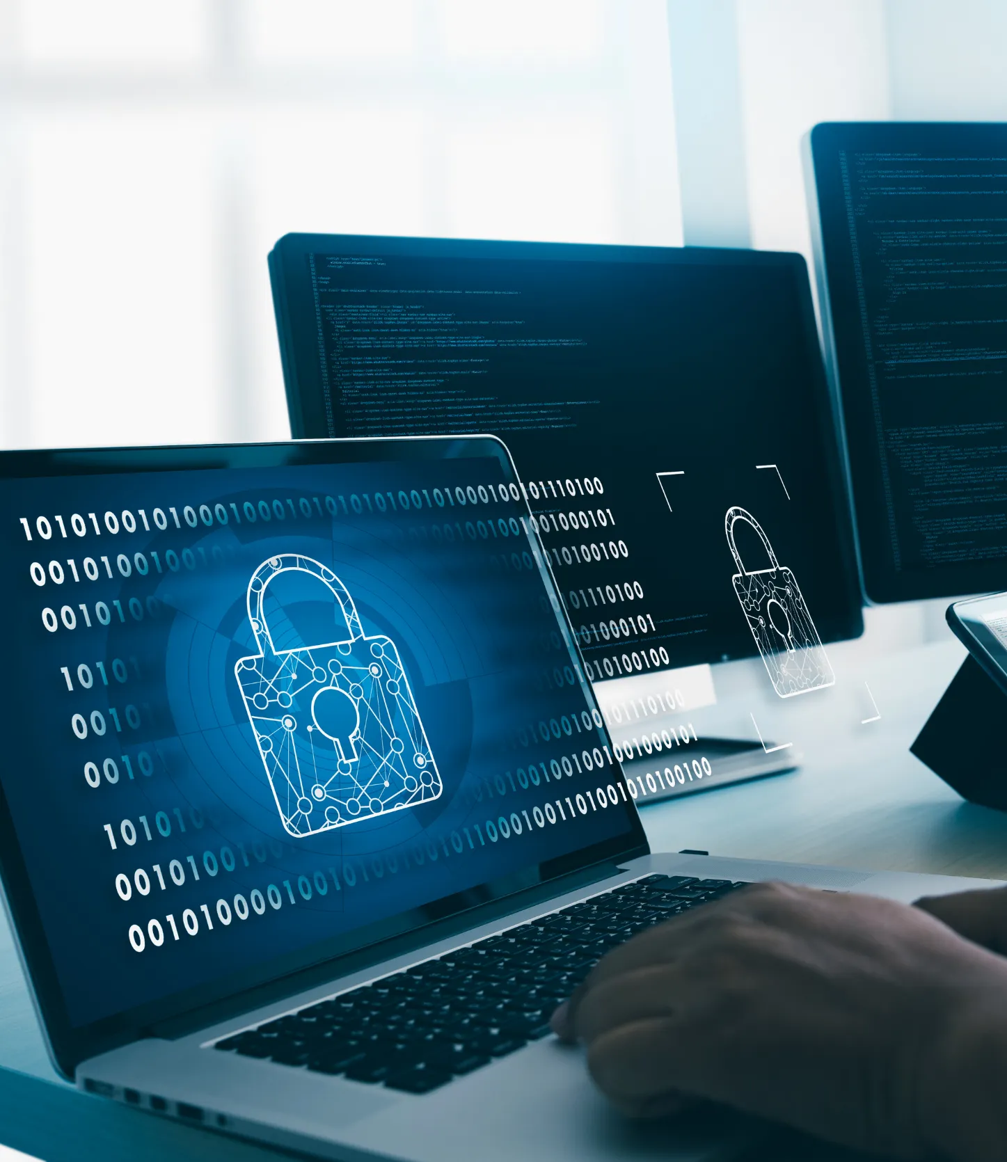 virus-2 A person uses a laptop displaying a digital padlock symbol, representing cybersecurity protection.
